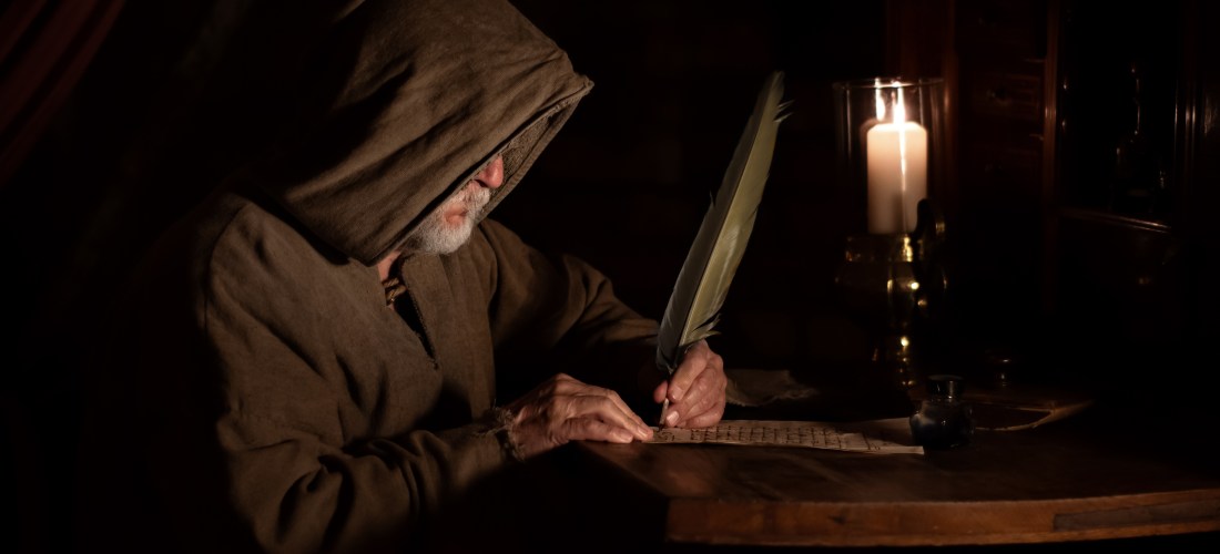 Monk in the Middle Ages writes old letter